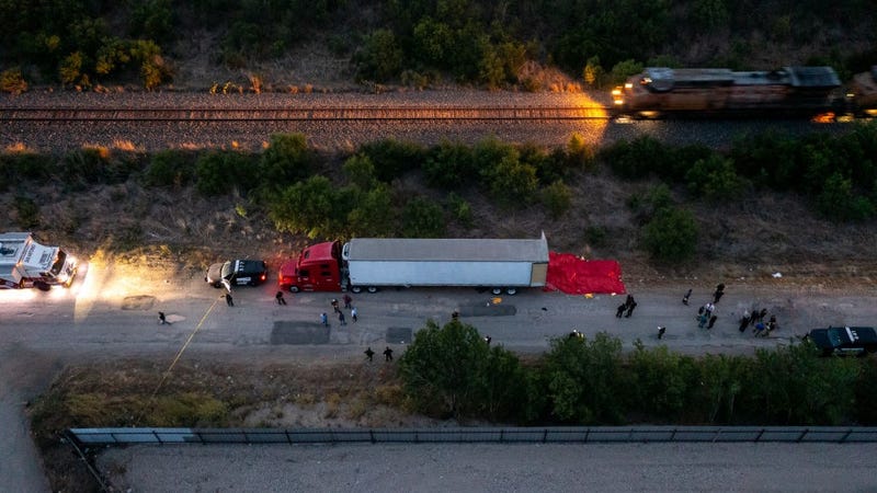  In this aerial view, members of law enforcement investigate a tractor trailer on June 27, 2022 in San Antonio, Texas. 