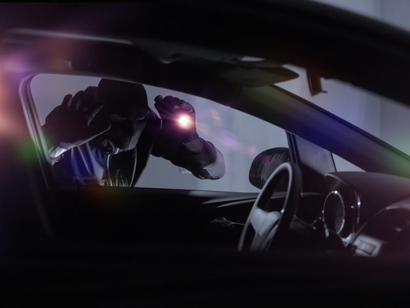 car theft in progress at night