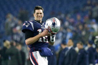 FILE - In this Jan. 4, 2020, file photo, New England Patriots quarterback Tom Brady warms up before an NFL wild-card playoff football game against the Tennessee Titans in Foxborough, Mass. (AP Photo/Elise Amendola, FIle)