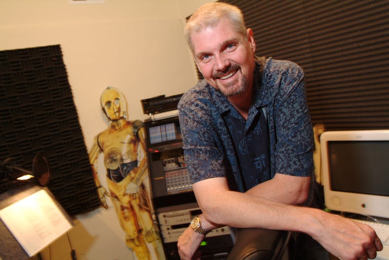 Tom Kane poses for photo in his recording studio