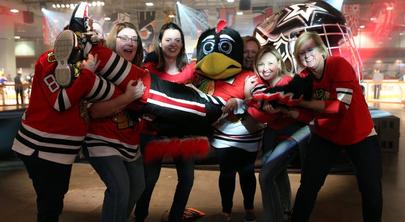 Jan 29, 2016; Nashville, TN, USA; The Chicago Blackhawks mascot interacts with a group of fans during the fan fair for the 2016 NHL All Star Game at Bridgestone Arena. Mandatory Credit: Aaron Doster-USA TODAY Sports