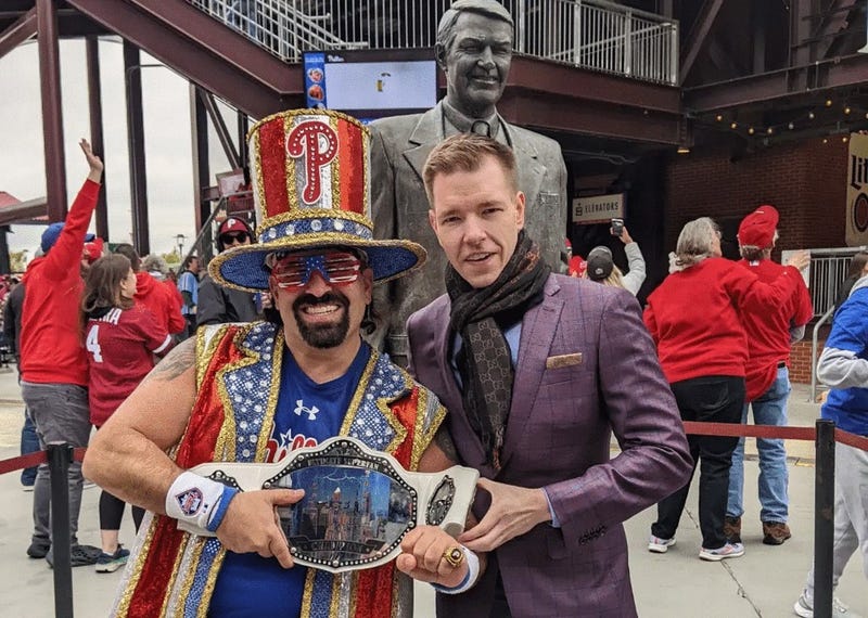 Tony "Tornado" Penecale (left) along with singer and broadcaster Kane Kalas at Citizens Bank Park, in front of the statue honoring Kalas' father, the late, legendary Phillies broadcaster Harry Kalas.