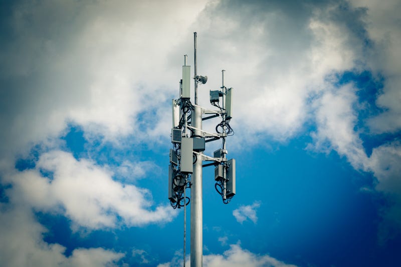 Telecommunication tower with 4G, 5G transmitters