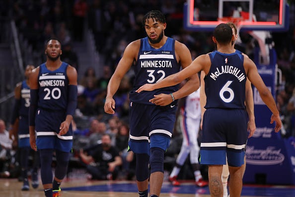 Karl-Anthony Towns heads back to the Timberwolves bench. 