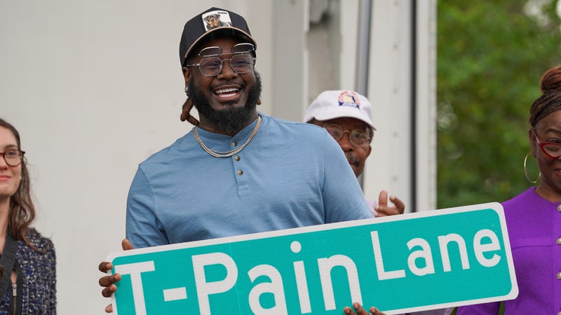 T-Pain displays the sign for "T-Pain Lane" during his street naming ceremony at the Walker Ford Community Center on November 10, 2024 in Tallahassee, Florida.