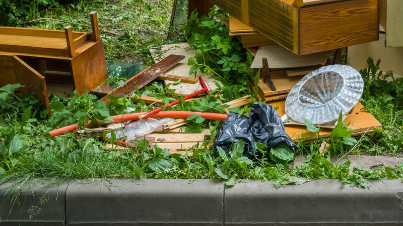 Trash and junk on the side of the road - stock photo