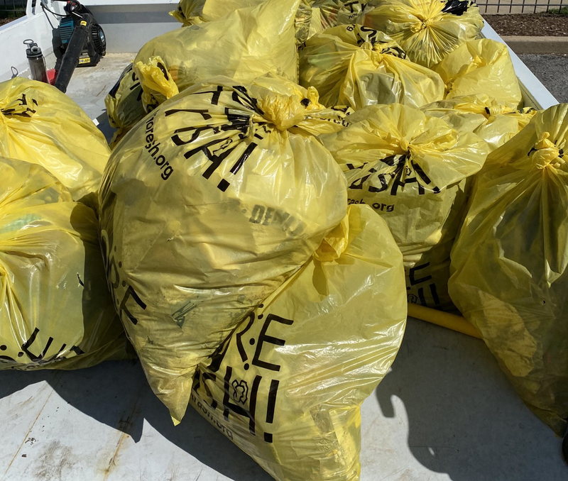 Piles of bags of roadside trash from a Charlie Brennan-organized clean-up