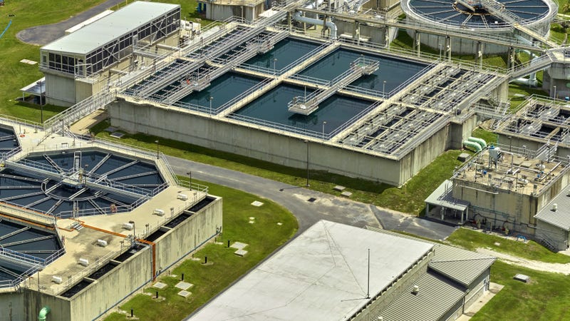 Aerial view of an urban wastewater treatment plant - stock photo