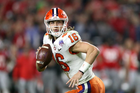 Clemson QB Trevor Lawrence rolls out looking for a receiver. 