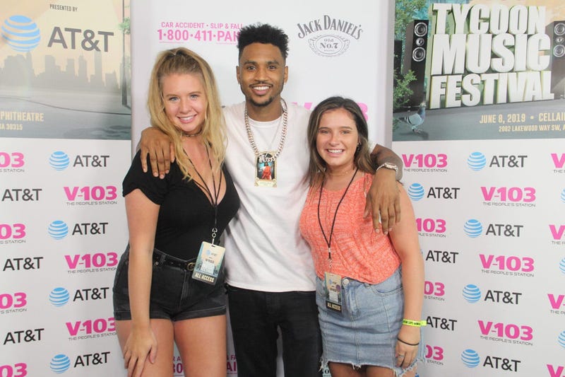Trey Songz takes a photo with fans