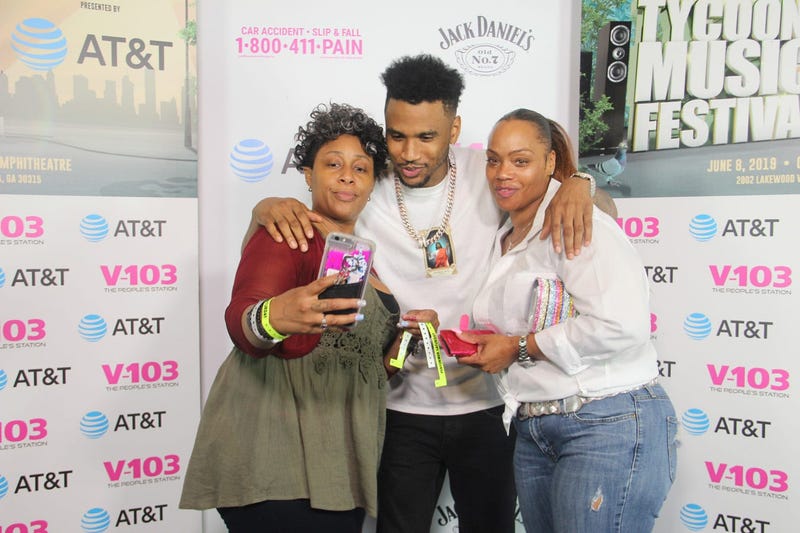 Trey Songz takes a photo with fans