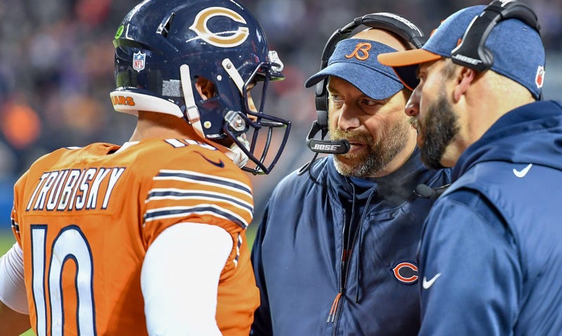 Bears coach Matt Nagy, center, talks with quarterback Mitchell Trubisky (10).