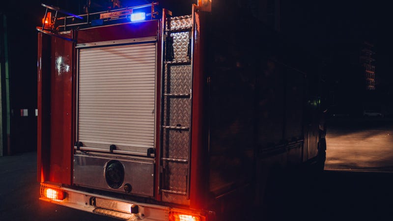 Truck exiting from the fire department - stock photo