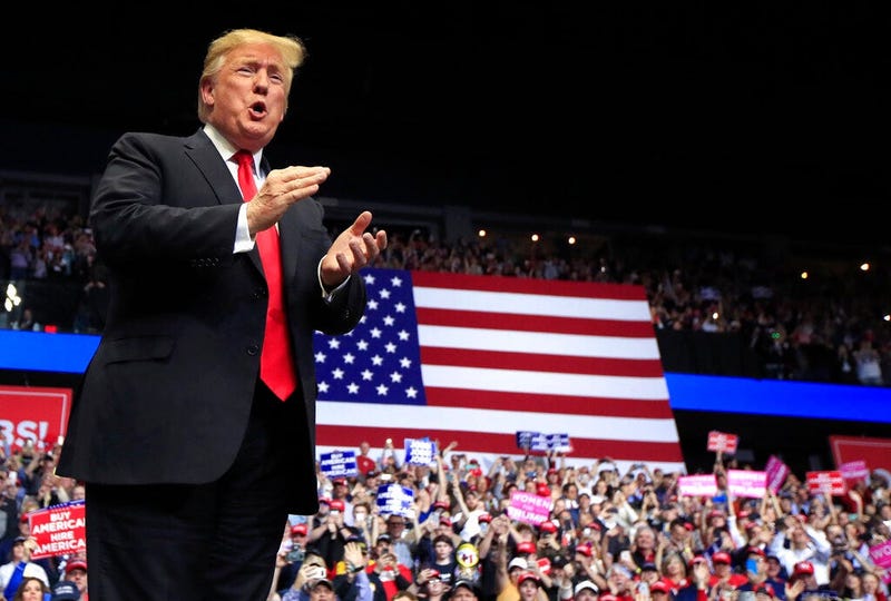 President Donald Trump arrives to speak at a rally in Grand Rapids, Mich.,