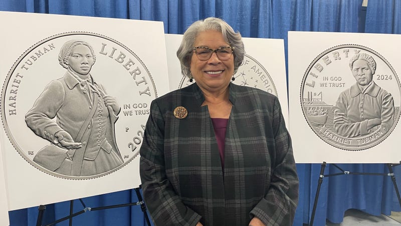 Ventris Gibson, director of the U.S. Mint, displays the designs for the mint's commemorative Harriet Tubman coins.