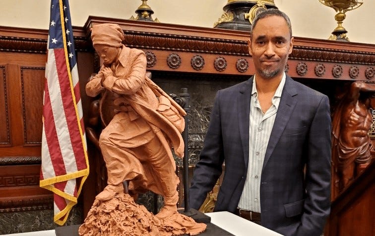 Alvin Pettit and a model of his Harriet Tubman statue