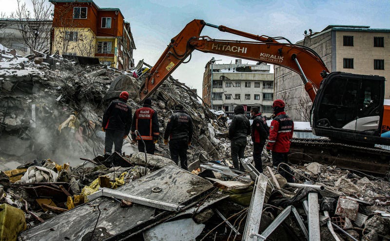 earthquake rubble and heavy equipment digging