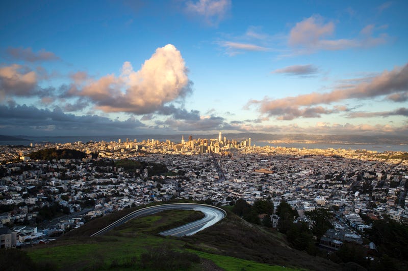 A view of San Francisco from Twin Peaks. The northern portion of Twin Peaks Boulevard is visible in the foreground.