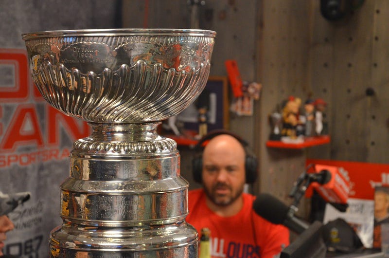 Johnny 'Cakes' Auville marvels at the Stanley Cup