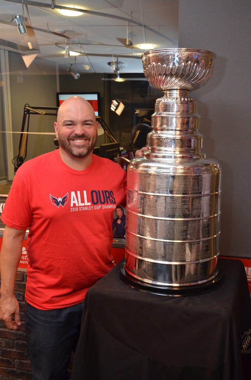 Cakes poses with the Stanley Cup