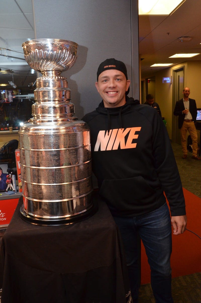 Matt 'Drab T-Shirt' Cahill poses with the Stanley Cup