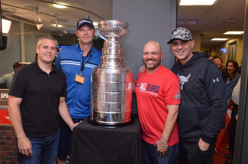 The Sports Junkies pose with The Stanley Cup