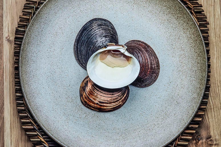 A dish of mahogany clams at Under restaurant