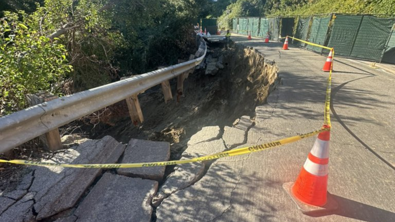 road spurt water beside traffic cones