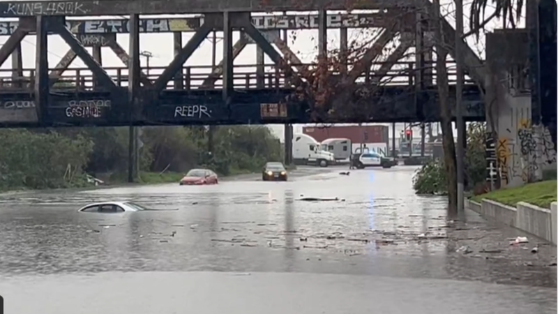 A driver apparently drove past a police car here in #LongBeach…and almost ended up in this “lake” on Willow Street under a railroad trestle…after two other vehicles ended up completely submerged 