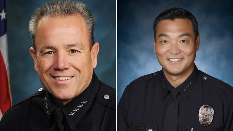 Outgoing LAPD Chief Michel Moore (L), incoming Interim Chief Dominic Choi (R)
