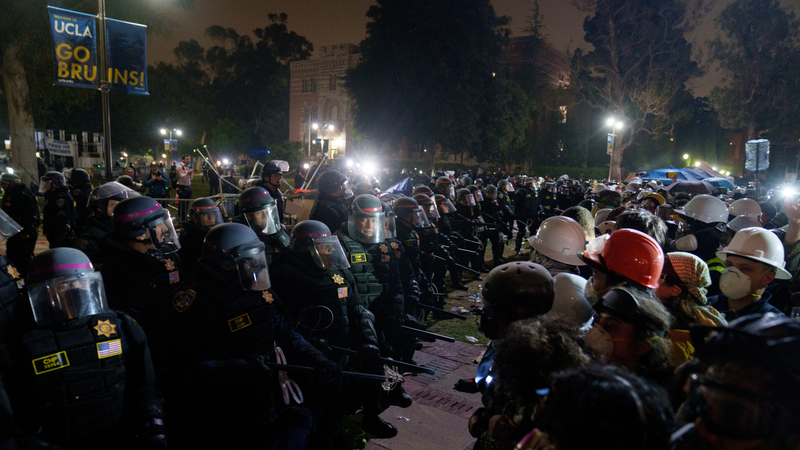 Members of law enforcement enter a Pro-Palestinian encampment at UCLA on May 2, 2024 in Los Angeles, California. The camp was declared 'unlawful' by the university and many protestors have been detained. Pro-Palestinian encampments have sprung up at college campuses around the country with some protestors calling for schools to divest from Israeli interests amid the ongoing war in Gaza.