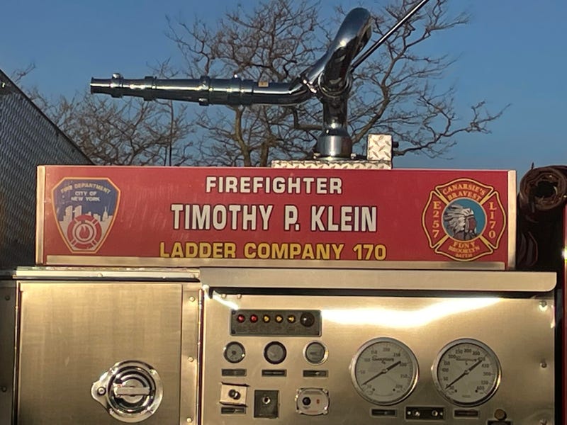 Firefighter Timothy Klein's name on a fire truck outside Church of Saint Francis DeSales in Belle Harbor on Friday morning