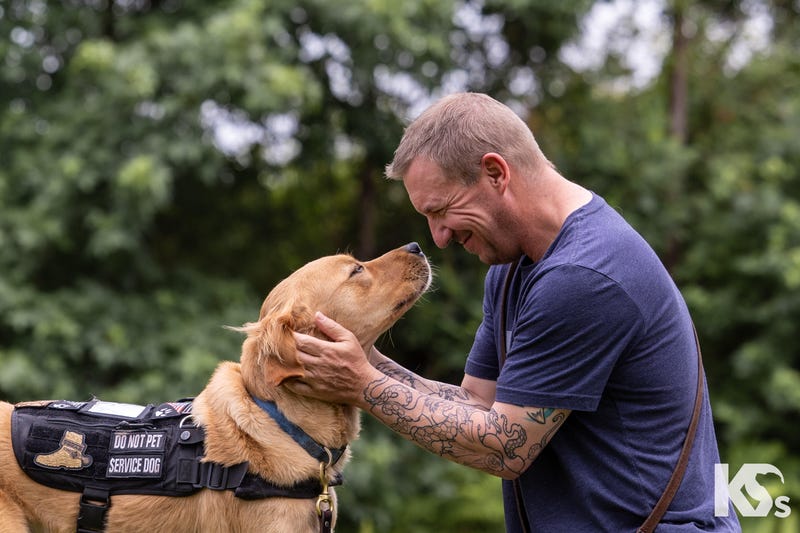 Will Garbe with his service dog, Bob. 
