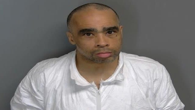Frowning man in white shirt