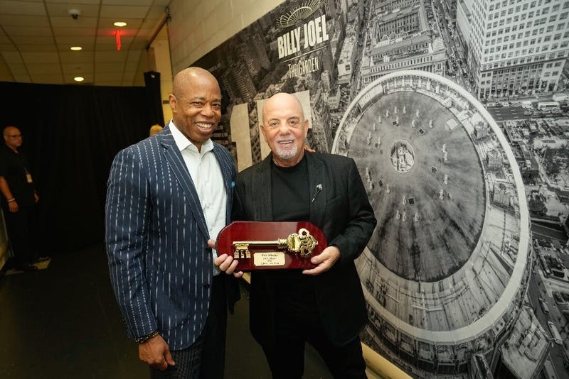 Billy Joel accepts the Key to the City of New York from Mayor Eric Adams.