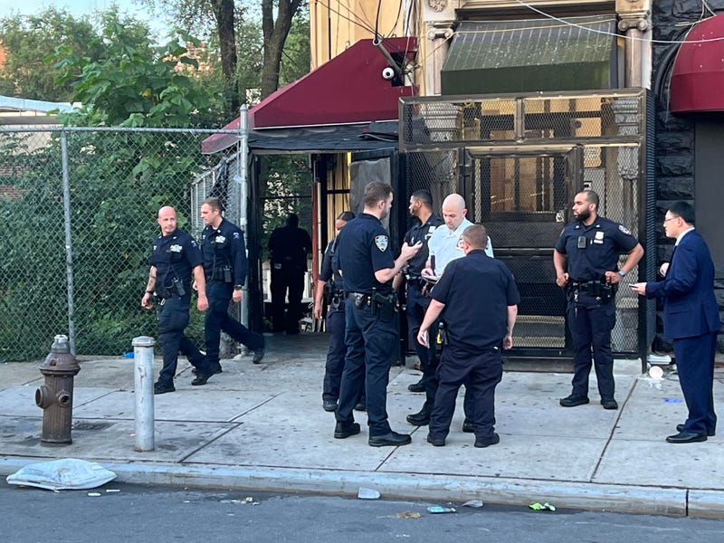 Police at the scene of a shooting in Morrisania that left three men wounded early Monday morning