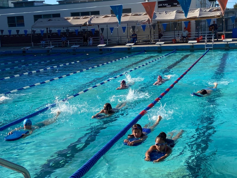 “Pleasant Hill Dolfins. Have fun, swim fast! ‘Have fun’ comes first for a reason,” head coach Talli Pitcher told KCBS Radio. “They’re going to swim fast if they’re here having fun with their friends.”