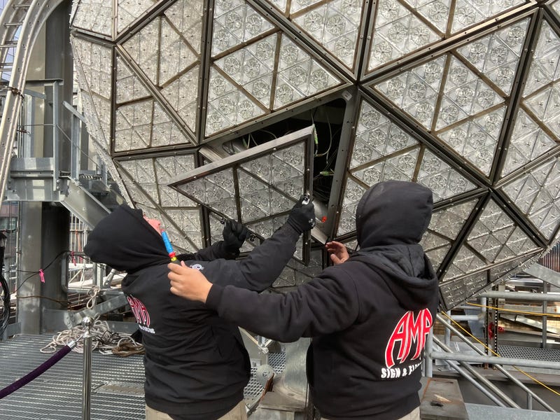 Workers install the ball atop One Times Square on Dec. 27, 2022