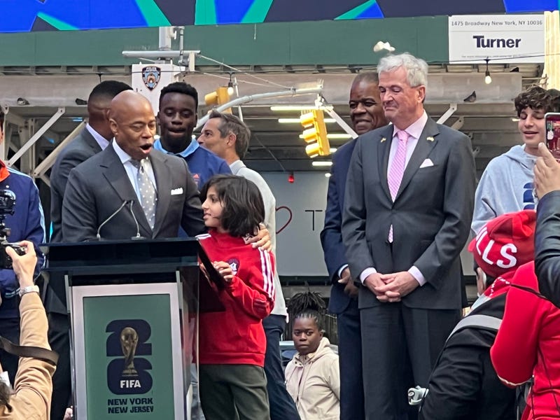Mayor Eric Adams and New Jersey Gov. Phil Murphy with a young soccer fan at Thursday's FIFA 2026 kickoff.