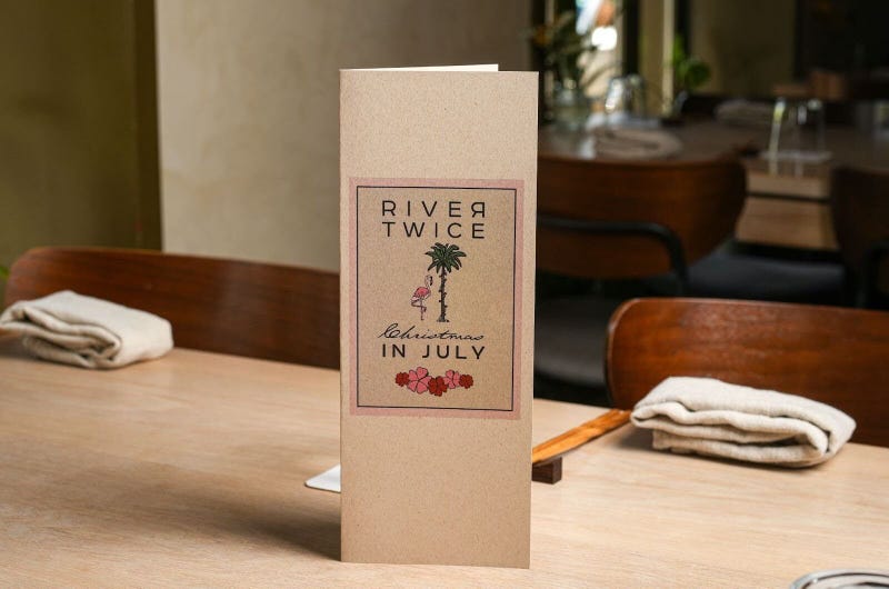 The cover of one of River Twice’s Christmas in July-themed tasting menus.