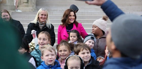 Group of children, governor and a turkey