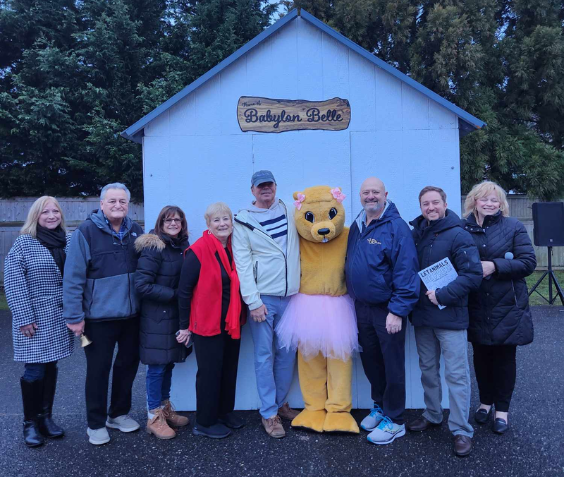 The village of Babylon introduced a human mascon, Babylon Belle, last year. Anthrozoologist John Di Leonardo (pictured second from right) has advocated for alternatives to real groundhogs