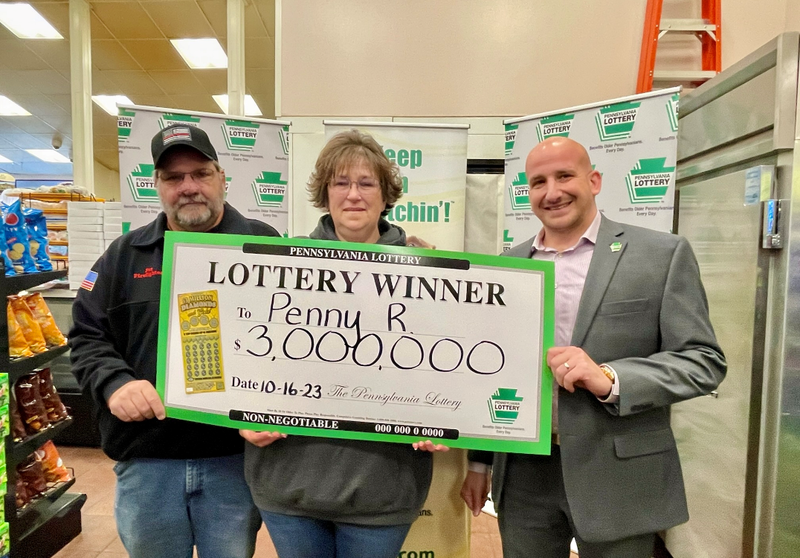 Pictured left to right: Pat Reep, Penny Reep, PA Lottery Area Sales Manager AJ Kaye
