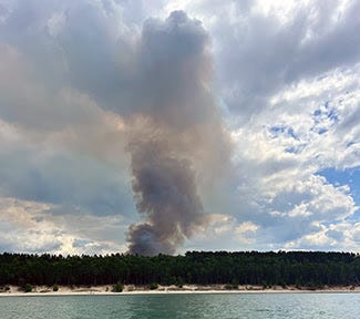 A 46-acre wildfire burning near the shores of Lake Superior since Sunday is now under control, authorities in the Upper Peninsula said on Tuesday afternoon.