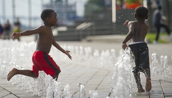 kids playing on a splash pad