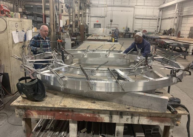 Fairmont Sign Company employees working on letter for Detroit Gateway sign