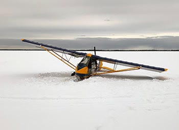 One man walked away unharmed after his plane suffered a power failure, forcing him to land on top of a frozen lake in the Upper Peninsula on Friday.