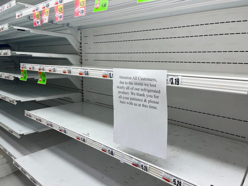 "Attention All Customers, due to the storm lost nearly all of our refrigerated product. We thank you for all your patience & please bare with us at this time." says the sign in the dairy section at the TOPS in Tonawanda.
