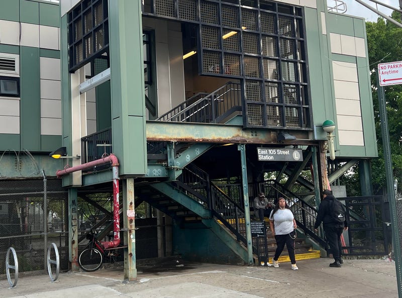 Subway riders enter the East 105th Street L-line station in Canarsie on Monday morning after a teen was stabbed and robbed there Sunday