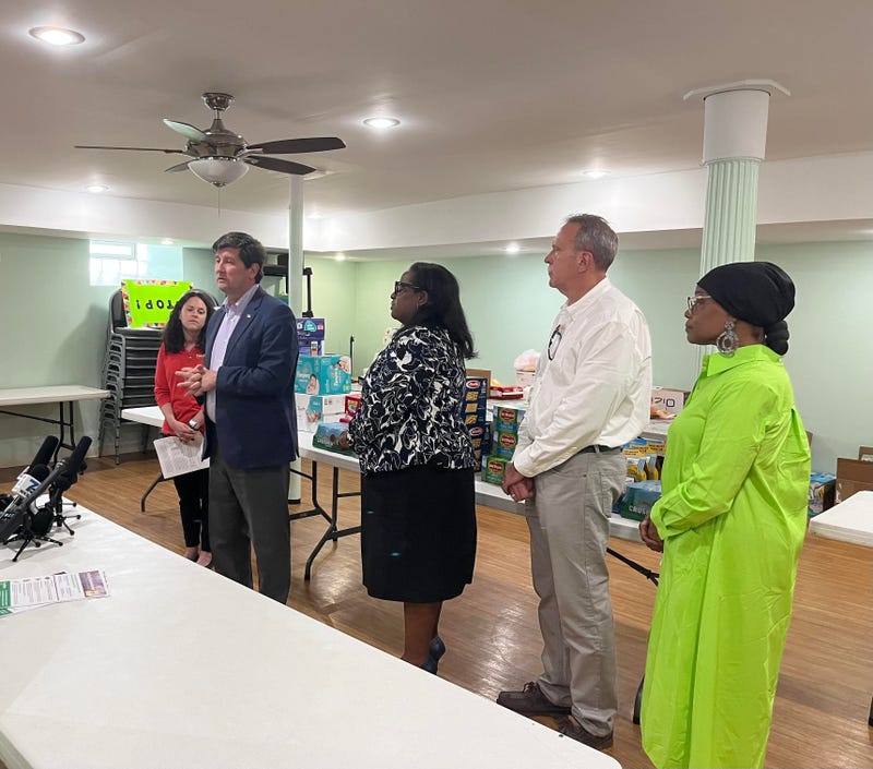 Erie County Executive Mark Poloncarz speaking alongside Feedmore's Catherine Shick and WNY Resource Council President, Catherine M. Roberts.
